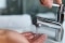 Hot water running from tap